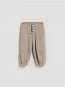 Spodenki dla niemowląt - Reserved - Dresowe spodnie oversize - beżowy - miniaturka - grafika 1