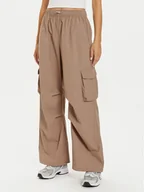 Spodnie sportowe damskie - New Balance Spodnie dresowe WP43534 Beżowy Relaxed Fit - miniaturka - grafika 1