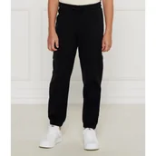 Spodnie i spodenki dla chłopców - Guess Spodnie dresowe | Regular Fit - miniaturka - grafika 1