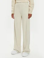 Spodnie sportowe damskie - Guess Spodnie dresowe O4BB02 KCHZ2 Beżowy Relaxed Fit - miniaturka - grafika 1