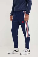 Spodnie męskie - adidas spodnie dresowe Tiro kolor granatowy z aplikacją IY4517 - miniaturka - grafika 1