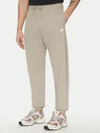 Spodnie sportowe męskie - New Balance Spodnie dresowe Essentials MP41519 Beżowy Relaxed Fit - miniaturka - grafika 1