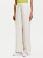 Spodnie sportowe damskie - Puma Spodnie dresowe Her 685061 Beżowy Straight Fit - miniaturka - grafika 1