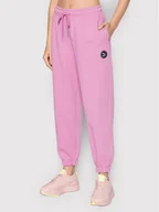 Spodnie sportowe damskie - Puma Spodnie dresowe SWxP 533567 Różowy Relaxed Fit - miniaturka - grafika 1