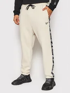 Spodnie sportowe męskie - Reebok Spodnie dresowe Tape HB2164 Beżowy Regular Fit - miniaturka - grafika 1