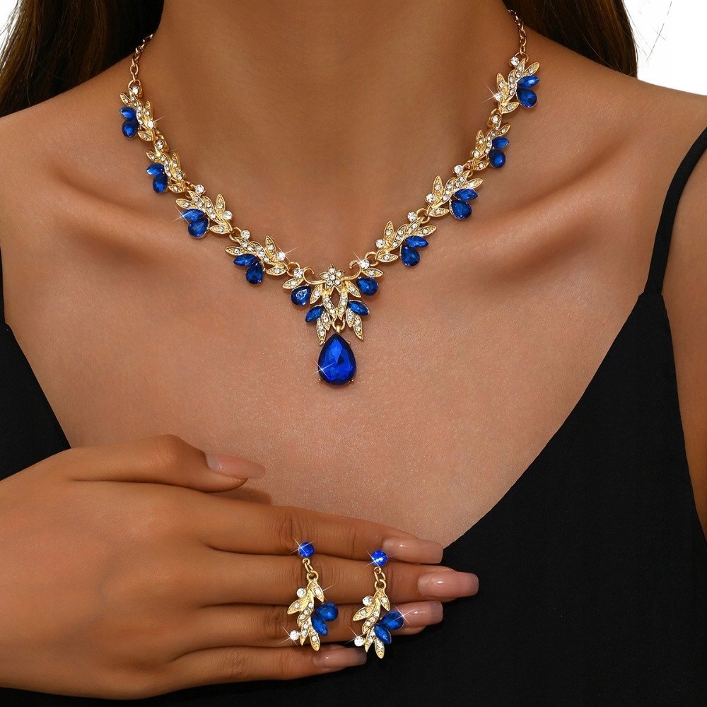 DUŻY KOMPLET BIŻUTERII DAMSKIEJ POZŁACANEJ Z NIEBIESKIMI KRYSZTAŁAMI