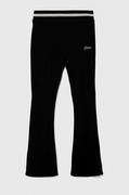 Spodnie i spodenki dla dziewczynek - Guess spodnie dresowe dziecięce kolor czarny gładkie - miniaturka - grafika 1