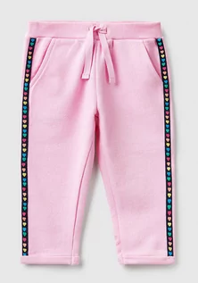 Spodnie i spodenki dla chłopców - Benetton Spodnie dresowe w kolorze jasnoróżowym - grafika 1