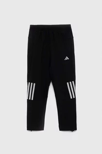 Spodnie i spodenki dla chłopców - adidas spodnie dresowe dziecięce U RUN WV kolor czarny z nadrukiem - grafika 1