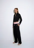 Spodnie damskie - Czarne spodnie dresowe lh team - miniaturka - grafika 1