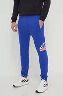 Spodnie męskie - adidas spodnie dresowe kolor niebieski z nadrukiem IS9594 - miniaturka - grafika 1