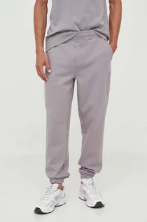 Spodnie męskie - Calvin Klein spodnie dresowe kolor szary z aplikacją - grafika 1