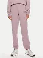 Spodnie sportowe damskie - New Balance Spodnie dresowe Graphic WP43500 Fioletowy Relaxed Fit - miniaturka - grafika 1