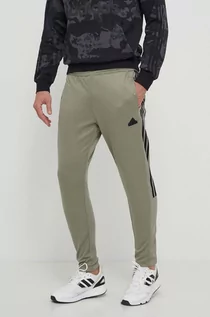 Spodnie męskie - adidas spodnie dresowe TIRO kolor zielony wzorzyste IS1504 - grafika 1