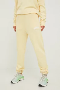 Spodnie damskie - Guess spodnie dresowe bawełniane damskie kolor żółty z nadrukiem - grafika 1