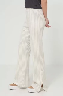 Spodnie damskie - Rip Curl spodnie damskie kolor beżowy dopasowane high waist - grafika 1