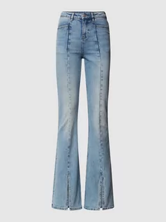 Spodnie damskie - Jeansy z wysokim stanem o kroju flared cut - grafika 1