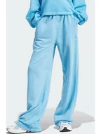 Spodnie sportowe damskie - adidas Spodnie dresowe "ESS+" w kolorze niebieskim - miniaturka - grafika 1