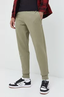 Spodnie męskie - Superdry spodnie dresowe bawełniane męskie kolor zielony gładkie - grafika 1