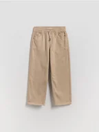 Spodnie i spodenki dla chłopców - Reserved - Wysokoelastyczne spodnie regular - beżowy - miniaturka - grafika 1