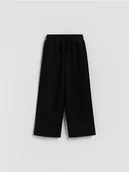 Spodnie i spodenki dla chłopców - Reserved - Dzianinowe spodnie z bawełną - czarny - miniaturka - grafika 1