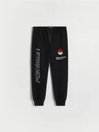 Spodnie i spodenki dla chłopców - Reserved - Dresowe spodnie Pokémon - czarny - miniaturka - grafika 1