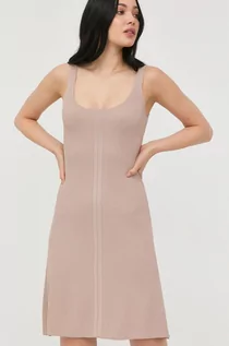 Sukienki - Guess sukienka kolor beżowy mini rozkloszowana - grafika 1