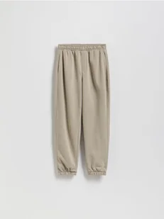 Reserved - Bawełniane spodnie jogger - beżowy - Spodnie i spodenki dla chłopców - miniaturka - grafika 1