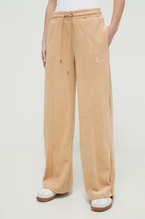 Spodnie damskie - Karl Kani spodnie dresowe welurowe kolor beżowy gładkie - grafika 1