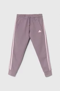 Spodnie i spodenki dla dziewczynek - adidas spodnie dresowe dziecięce kolor fioletowy gładkie - grafika 1