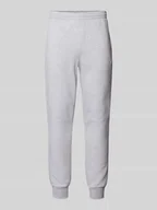 Spodnie sportowe męskie - Spodnie dresowe o kroju slim fit z naszywką z logo - miniaturka - grafika 1