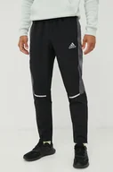Spodnie męskie - adidas Performance spodnie dresowe męskie kolor czarny z nadrukiem - miniaturka - grafika 1