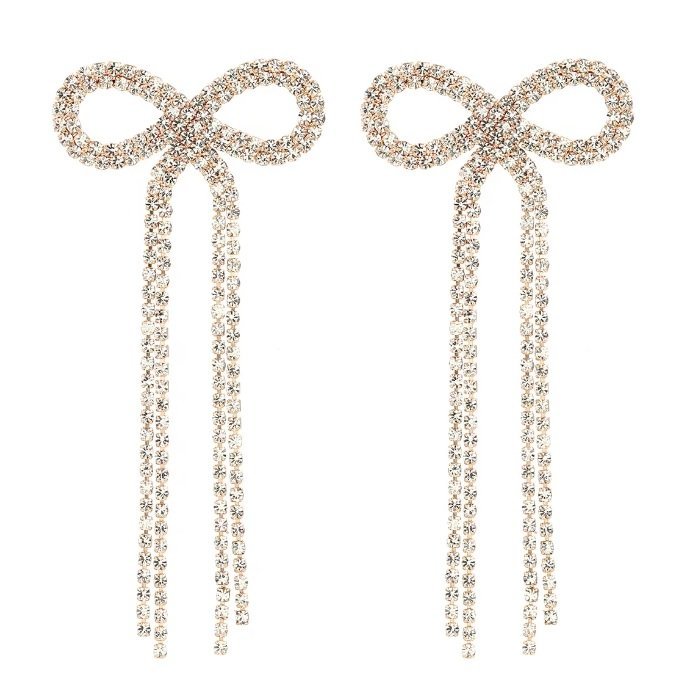 Kolczyki długie nitki cyrkoniowe złote z kryształkami kokardki eleganckie GLAM