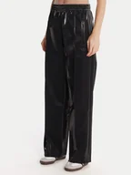 Spodnie sportowe damskie - adidas Spodnie dresowe adicolor Holiday JV7503 Czarny Loose Fit - miniaturka - grafika 1