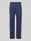 Spodnie sportowe męskie - Spodnie dresowe ze szwami podłużnymi i nadrukiem z logo - miniaturka - grafika 1