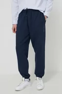 Spodnie męskie - Tommy Jeans spodnie dresowe bawełniane kolor granatowy gładkie - miniaturka - grafika 1