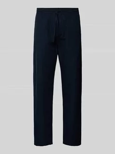 Spodnie męskie - Spodnie materiałowe o kroju relaxed fit ze wzorem w paski - grafika 1