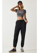 Spodnie sportowe damskie - Happiness Istanbul Spodnie dresowe w kolorze czarnym - miniaturka - grafika 1