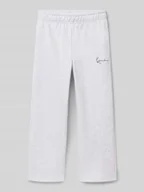 Spodnie i spodenki dla chłopców - Spodnie dresowe o kroju straight fit z nadrukiem z logo - miniaturka - grafika 1