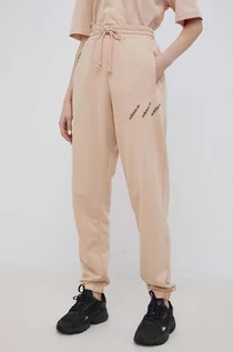 Spodnie damskie - Adidas Originals Originals spodnie damskie kolor beżowy z nadrukiem - Originals - grafika 1