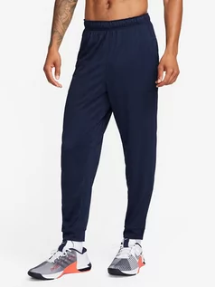 Spodnie sportowe męskie - Nike Spodnie sportowe w kolorze granatowym - grafika 1