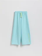 Spodnie i spodenki dla dziewczynek - Reserved - Spodnie dresowe z nadrukiem - jasnoturkusowy - miniaturka - grafika 1