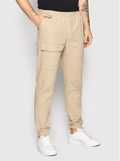 Spodnie damskie - Outhorn Spodnie materiałowe SPMC600 Beżowy Regular Fit - grafika 1