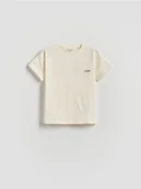 Bluzki dla niemowląt - Reserved - Bawełniany t-shirt - złamana biel - miniaturka - grafika 1