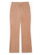 Spodnie sportowe damskie - Juicy Couture Spodnie dresowe w kolorze beżowym - miniaturka - grafika 1