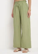 Spodnie damskie - Jasnozielone Szerokie Bawełniane Spodnie Palazzo z Wysokim Stanem i Elastyczną Gumką w Pasie Nelonia - miniaturka - grafika 1
