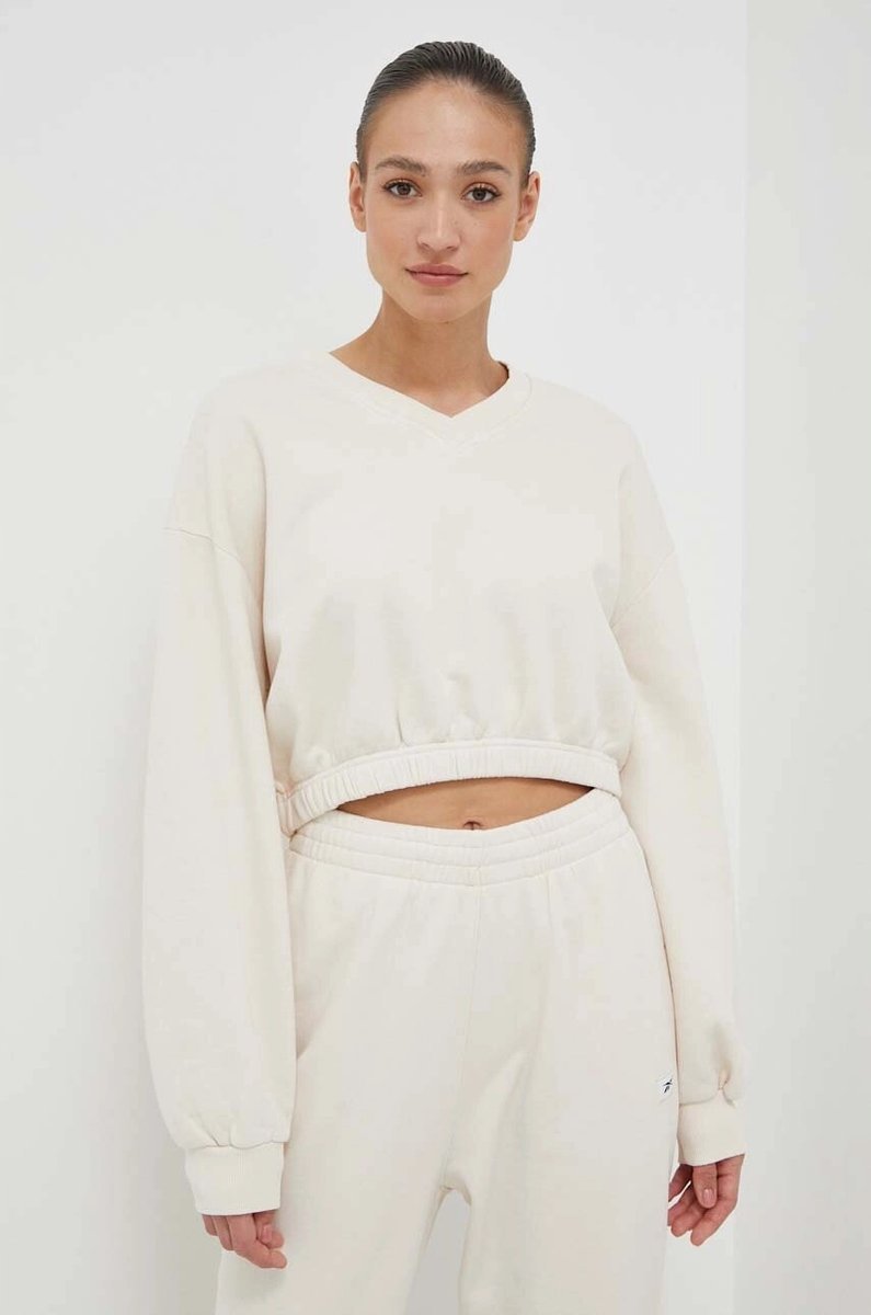 BLUZA SPORTOWA DAMSKA REEBOK R. S SZPIC ŚCIĄGACZE KRÓTKA KREMOWA