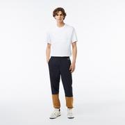 Spodnie męskie - Lacoste Spodnie dresowe Showerproof Colourblock - miniaturka - grafika 1