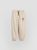 Spodnie i spodenki dla chłopców - Reserved - Joggery z efektem sprania - kremowy - miniaturka - grafika 1
