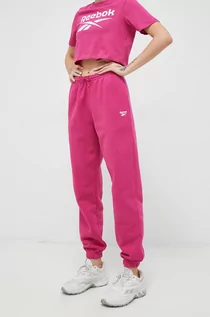 Spodnie damskie - Reebok spodnie dresowe kolor różowy gładkie - grafika 1